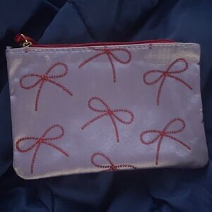 Ipsy Purple Cosmetic Bag with Red Bow Design